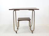 a small table with a stool on it in a room