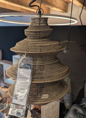a lamp that is hanging from a ceiling in a room
