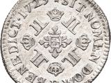 an old silver coin with a crown on top of it