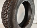 a close up of a tire on a white surface