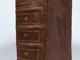 a close up of a book on a white surface with a white background