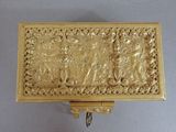 a gold box with a picture of a man and a woman on it