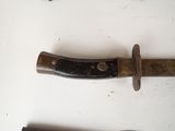 a knife that is laying on a table