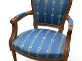 an image of a chair with a blue upholstered upholstered seat