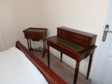 a bed and a desk in a small room