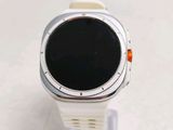 a smart watch sitting on a stand on a table