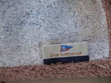 a close up of a towel with a name tag on it