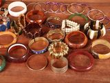 a lot of bracelets and bangles on a table
