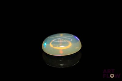 an image of a white disc with a light on it