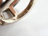 a close up of a ring on a white surface