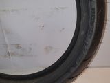 a close up of a tire tire on a white surface