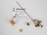 toy figurines of a man with a cane and a sign