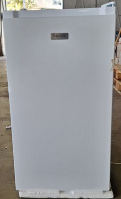 an image of a white refrigerator in a warehouse