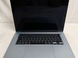 an apple macbook pro laptop computer sitting on top of a white table
