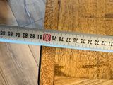 a measuring tape that is on the floor next to a chair