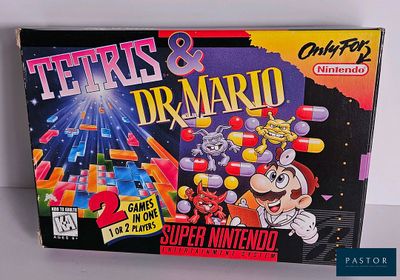 a box of tetris and dr mario on the table