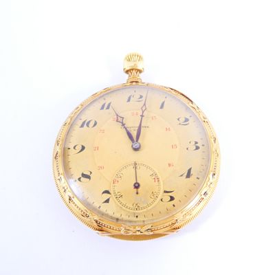 a gold pocket watch with roman numerals on the face