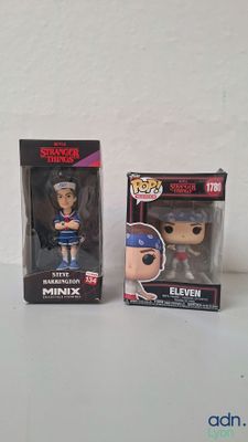 deux figurines Funko Pop en vinyle représentant une femme en tenue de baseball et un homme portant une casquette de baseball