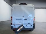 the back of a van with the door open in a garage