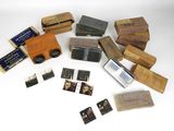 an image of a collection of old photographs and other items on a table