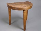 an image of a small wooden table with a curved top