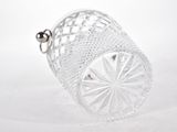 a glass vase that is sitting on a white surface