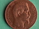 a close up of a coin with a man ' s face on it