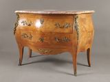 an image of a wooden chest of drawers with marble top