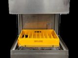 gros plan d'une machine avec un plateau jaune à l'intérieur