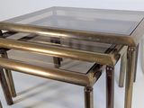 three tables with glass tops on a white background