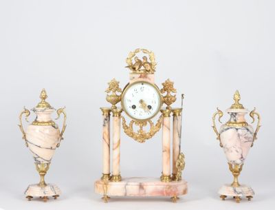 three different types of clocks and vases sitting on a table