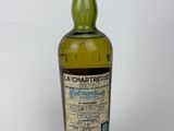 a bottle of la chartreuse whisky on a white background