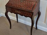a small table with a chess board on top of it