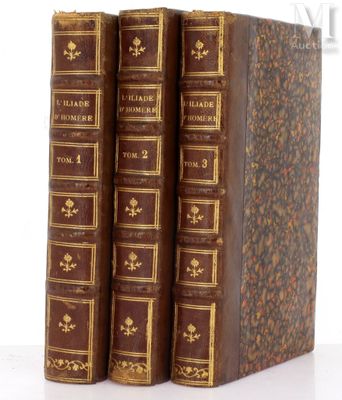 three books sitting on top of each other on a white surface