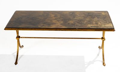 an antique brass coffee table with a marble top