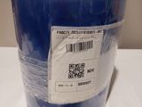 a blue bucket with a label on it sitting on a table