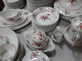 a lot of plates and cups on the table