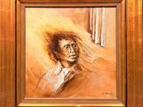 tableau représentant un homme aux cheveux longs, dans un cadre doré