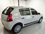 a picture of a white car parked in a garage
