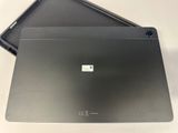 two laptops sitting side by side on a table