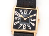 an image of a black and gold wrist watch with roman numerals