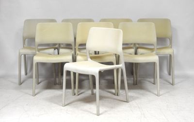 six white chairs sitting in a row on a white floor