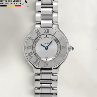 a close up of a wrist watch with roman numerals on it
