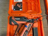 an orange tool box with a stapler and a stapler in it