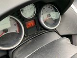 a dashboard with a speedometer, gauges, and other items in it