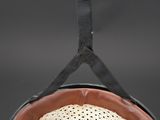 an image of a hat hanging from a hook