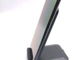 a cell phone that is sitting on top of a stand