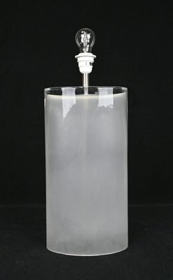 a clear glass with a light bulb on top of it