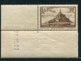 a close up of a stamp with a castle on it