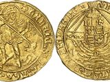 a gold coin with an image of a man holding a sword